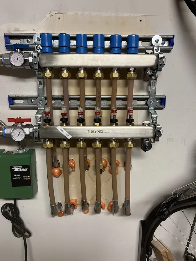 Plumber performing Water Heater Repair at a residential property in St. Michael